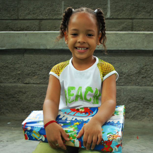 A child participating in the “Glass of Milk” program